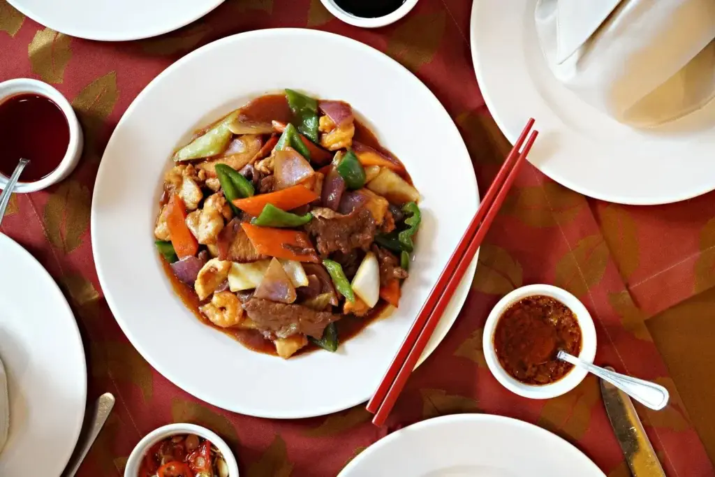 Chinese beef stir fry with peppers and chopsticks