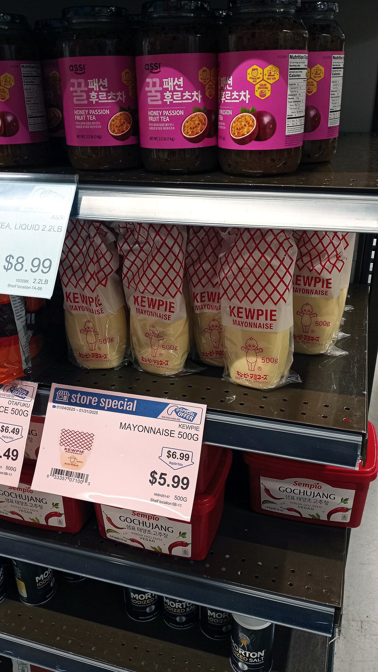 Tubs of gochujang on a Korean supermarket shelf